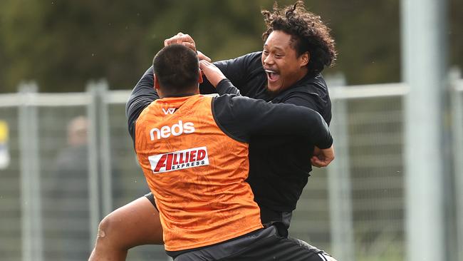 Joseph and Luciano Leilua share a laugh at training. Picture: Phil Hillyard