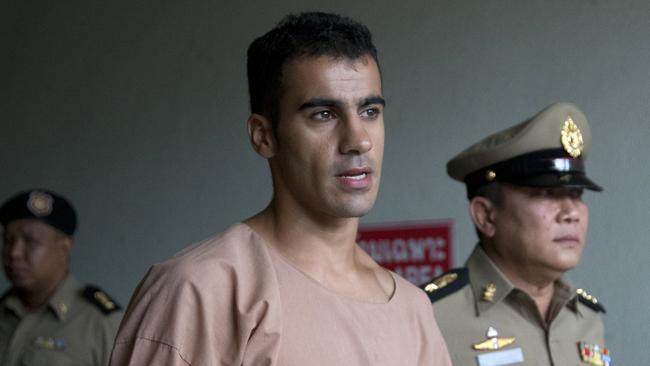 Bahraini football player Hakeem al-Araibi leaves the criminal court in Bangkok, Thailand, Bangkok, Thailand, Monday, Feb. 4, 2019. The soccer player who has refugee status in Australia told a Thai court Monday that he refuses to be voluntarily extradited to Bahrain, which has asked for his return to serve a prison sentence for a crime he denies committing.(AP Photo/Sakchai Lalit)