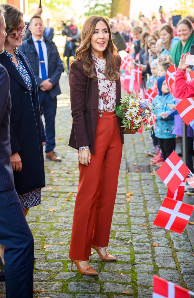 Queen Mary of Denmark greets fans outside the Schleswig-Holstein state government building in Kiel, Germany. Picture: Getty Images