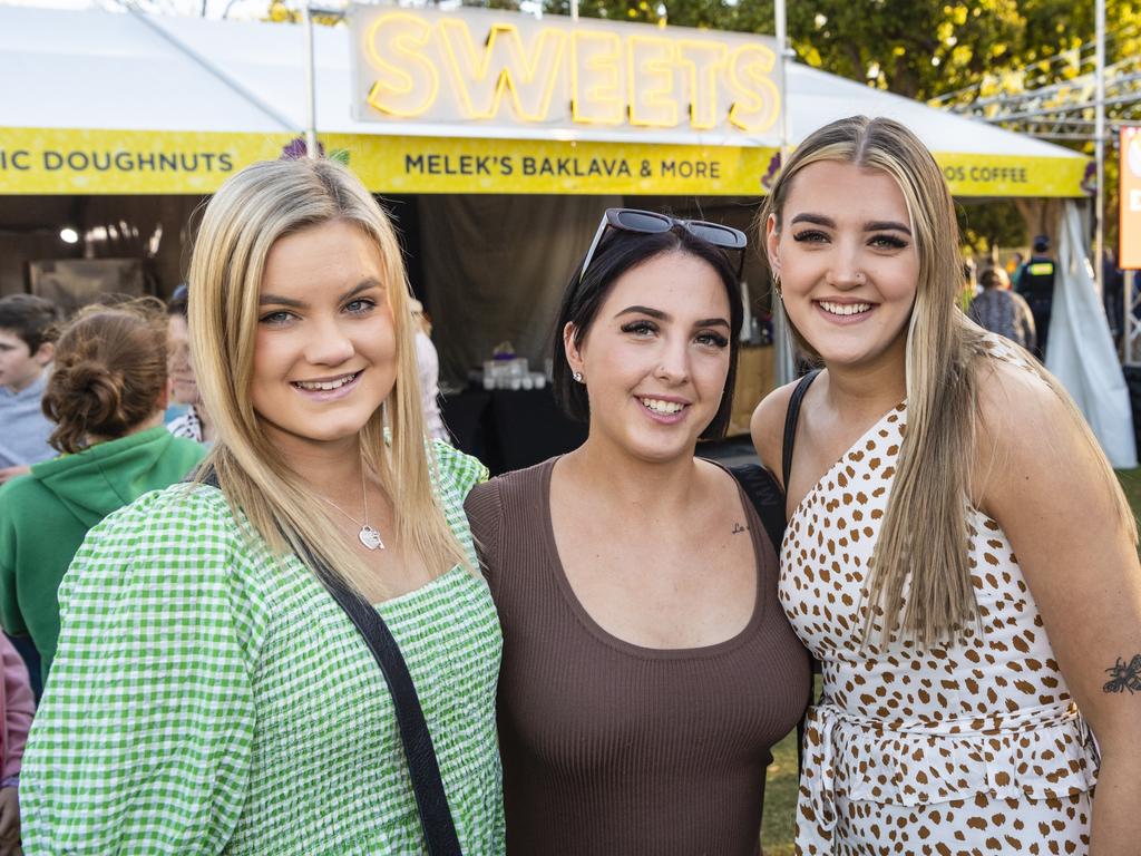 At the Festival of Food and Wine are (from left) Emma Frasle, Alex Ivory and Kristy Errington, Carnival of Flowers 2022, Saturday, September 10, 2022. Picture: Kevin Farmer