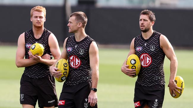 Port Adelaide’s Willem Drew, Robbie Gray and Travis Boak at training on Friday. Picture: Sarah Reed/Getty Images.