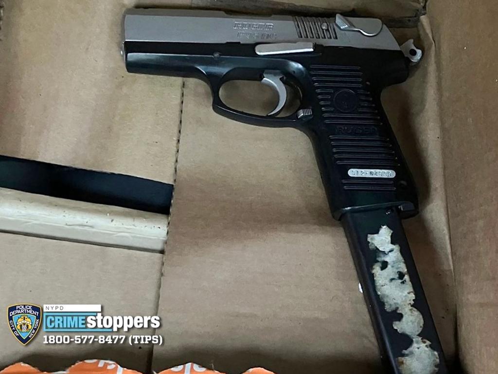 This handout image released by the New York Police Department (NYPD) via X on December 5, 2024 shows the firearm recovered at the scene of the shooting.