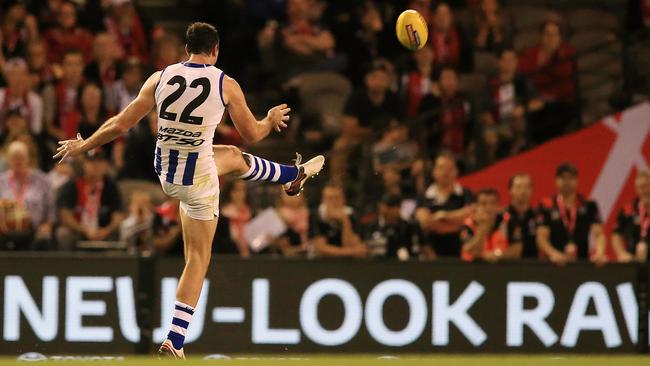 Todd Goldstein kicks the go-ahead point. Picture: Wayne Ludbey