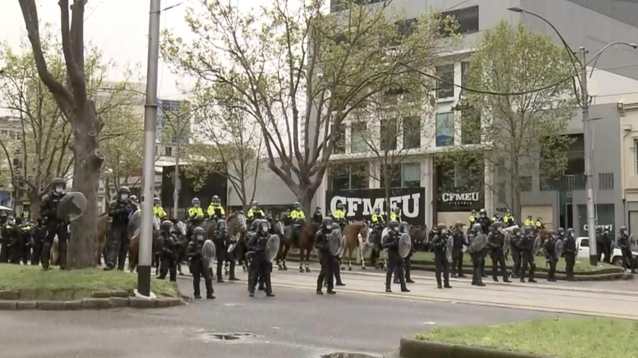 Police surround the CFMEU office on Tuesday morning.