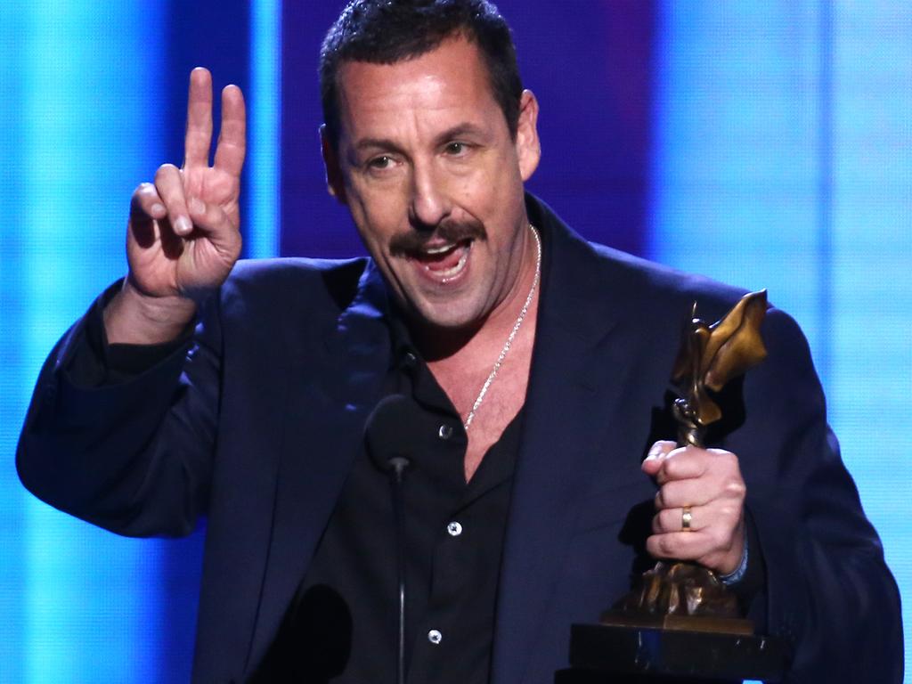 Adam Sandler accepts the Best Male Lead award for 'Uncut Gems' during the 2020 Film Independent Spirit Awards.