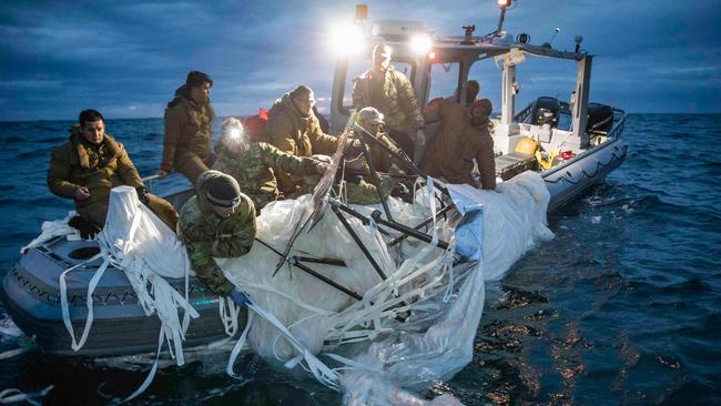 US Navy sailors recover parts of the Chinese spy balloon off the coast of South Carolina. Picture: US Navy/AFP