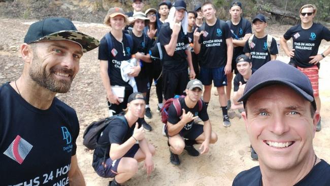 Steve "Commando" Willis and Cherrybrook High School' teacher Richard Pedley-Smith with staff and students.