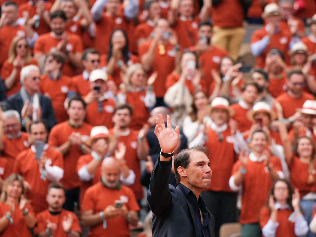 Rafael Nadal waves to the crowd wearing tribute t-shirts at Roland Garros. Picture: Dimitar DILKOFF / AFP