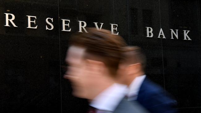 A pedestrian walks past the Reserve Bank of Australia building in Sydney. Picture: AAP