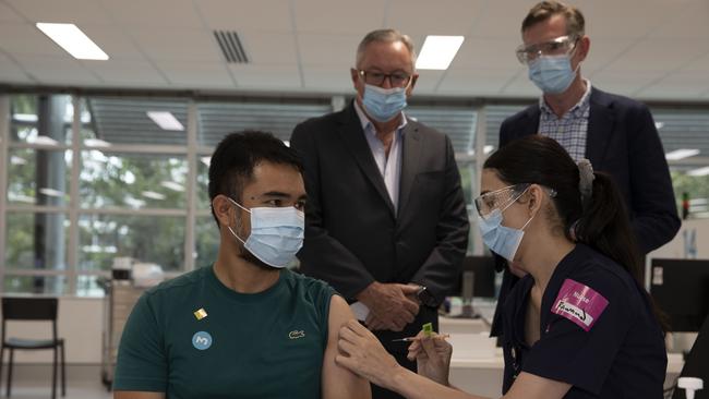 Mr Perrottet and Mr Hazzard observe booster shots being administered on Sunday. Picture: Pool