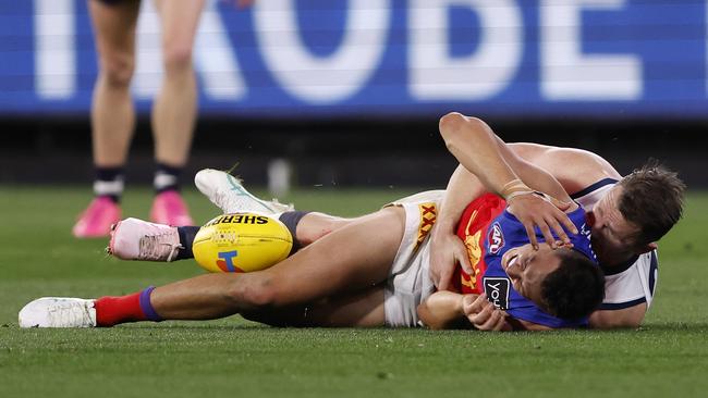 The Lion reached for his head as soon as it made contact with the turf. (Photo by Darrian Traynor/AFL Photos/via Getty Images)