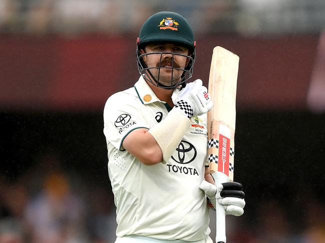 BRISBANE, AUSTRALIA - JANUARY 26: Travis Head of Australia looks dejected after losing his wicket during day two of the Second Test match in the series between Australia and West Indies at The Gabba on January 26, 2024 in Brisbane, Australia. (Photo by Bradley Kanaris/Getty Images)