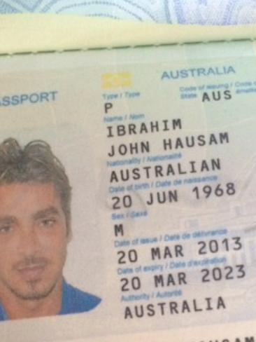 A section of John Ibrahim’s passport with his birth date correction.