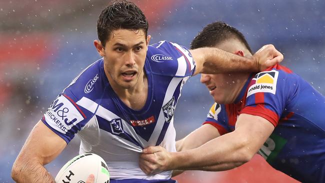 Nick Meaney is tackled by Bradman Best during a round 11 clash.