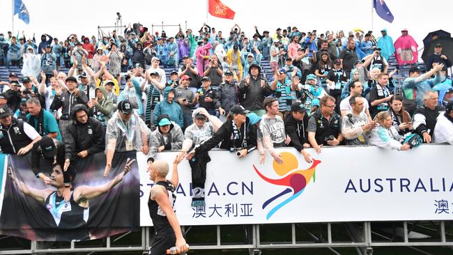 Sam Powell-Pepper celebrates with the crowd in Shanghai.