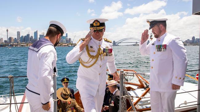 Hammond salutes as he boards HMAS Diamantina during Australia Day celebrations.