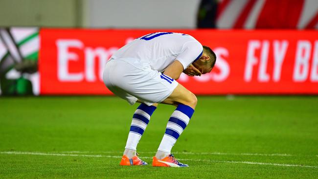 Uzbekistan forward Marat Bikmaev reacts after missing a penalty. Picture: AFP