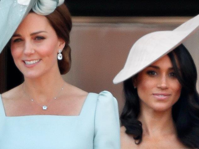 LONDON, UNITED KINGDOM - JUNE 09: (EMBARGOED FOR PUBLICATION IN UK NEWSPAPERS UNTIL 24 HOURS AFTER CREATE DATE AND TIME) Catherine, Duchess of Cambridge and Meghan, Duchess of Sussex stand on the balcony of Buckingham Palace during Trooping The Colour 2018 on June 9, 2018 in London, England. The annual ceremony involving over 1400 guardsmen and cavalry, is believed to have first been performed during the reign of King Charles II. The parade marks the official birthday of the Sovereign, even though the Queen's actual birthday is on April 21st. (Photo by Max Mumby/Indigo/Getty Images)