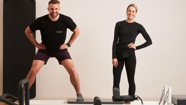 Kickboxer Matt Stevens with FORM Pilates owner and instructor Clancy Sullivan, happy to be reopen. Picture: Matt Loxton