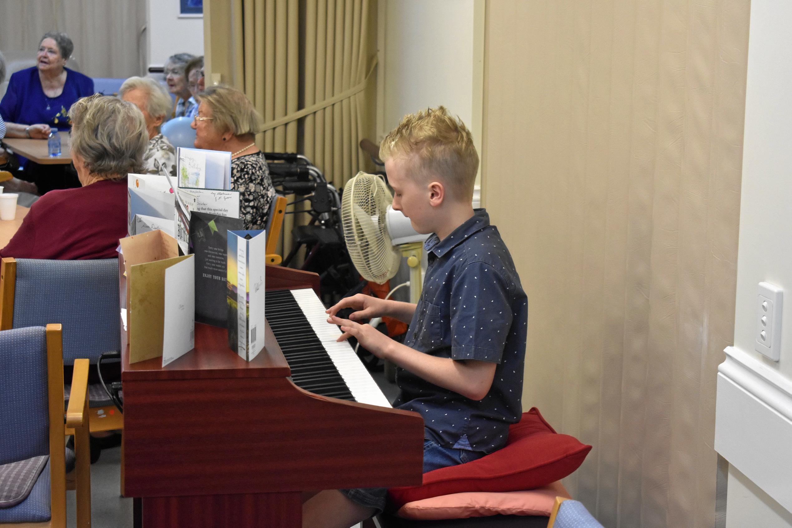 Matthew Rowlings plays the piano for Dexter's 109th birthday. Picture: Jorja McDonnell