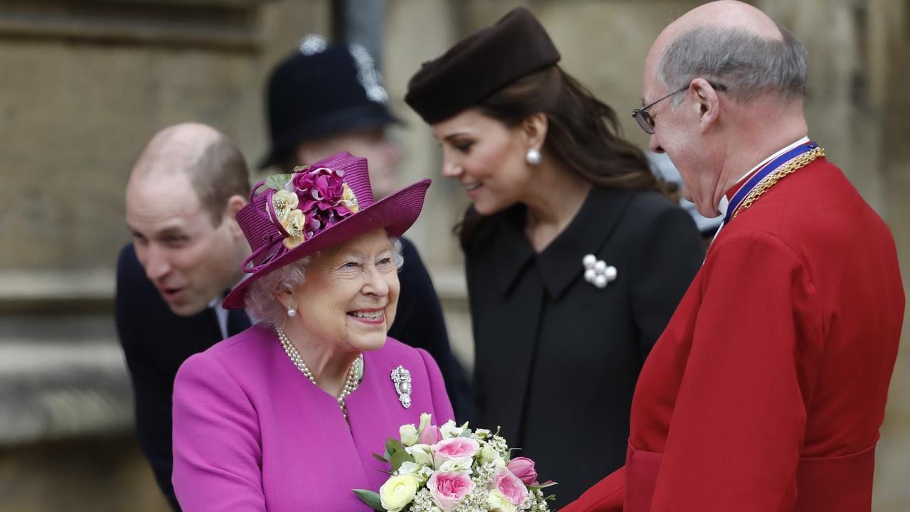 Prince William and Kate greet children outside St George’s Chapel with the Queen at Windsor Castle after an Easter service in 2018. Picture: Tolga Akmen/ Getty Images