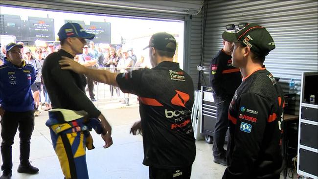 Mark Winterbottom (left) gets into a heated argument with Erebus Motorsport team boss Barry Ryan (middle) and driver Will Brown (right) after their crash at Pukekohe Park Raceway. Photo: Fox Sports