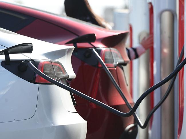 PASADENA, CALIFORNIA - SEPTEMBER 23: Tesla electric vehicles (EVs) recharge at a Tesla Supercharger station on September 23, 2024 in Pasadena, California. The California Air Resources Board announced that Californiaâs carbon dioxide emissions dropped 2.4 percent in 2022, even as the economy rebounded from the COVID-19 pandemic, primarily due to electric vehicle use and cleaner fuels.   Mario Tama/Getty Images/AFP (Photo by MARIO TAMA / GETTY IMAGES NORTH AMERICA / Getty Images via AFP)