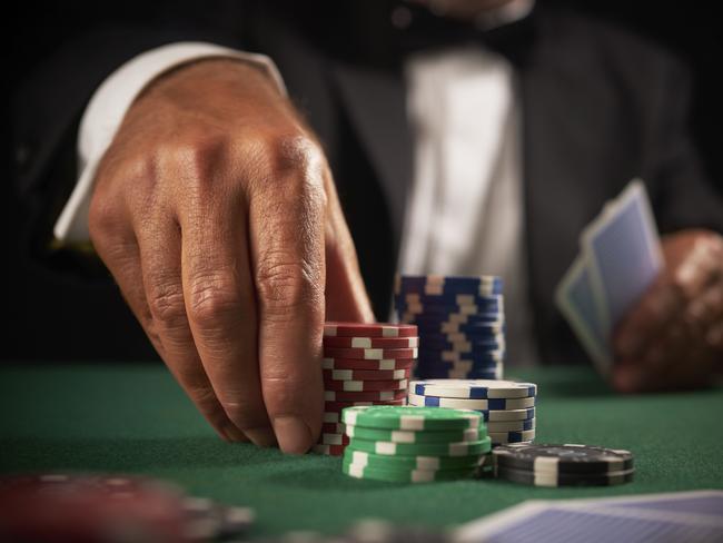 card player gambling casino chips on green felt background selective focus