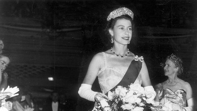 1954 Royal Tour. Queen Elizabeth at the State Ballroom in Hobart for a civic reception. Her gown is of the palest lithe pink swiss embroided organdie. Tasmania.