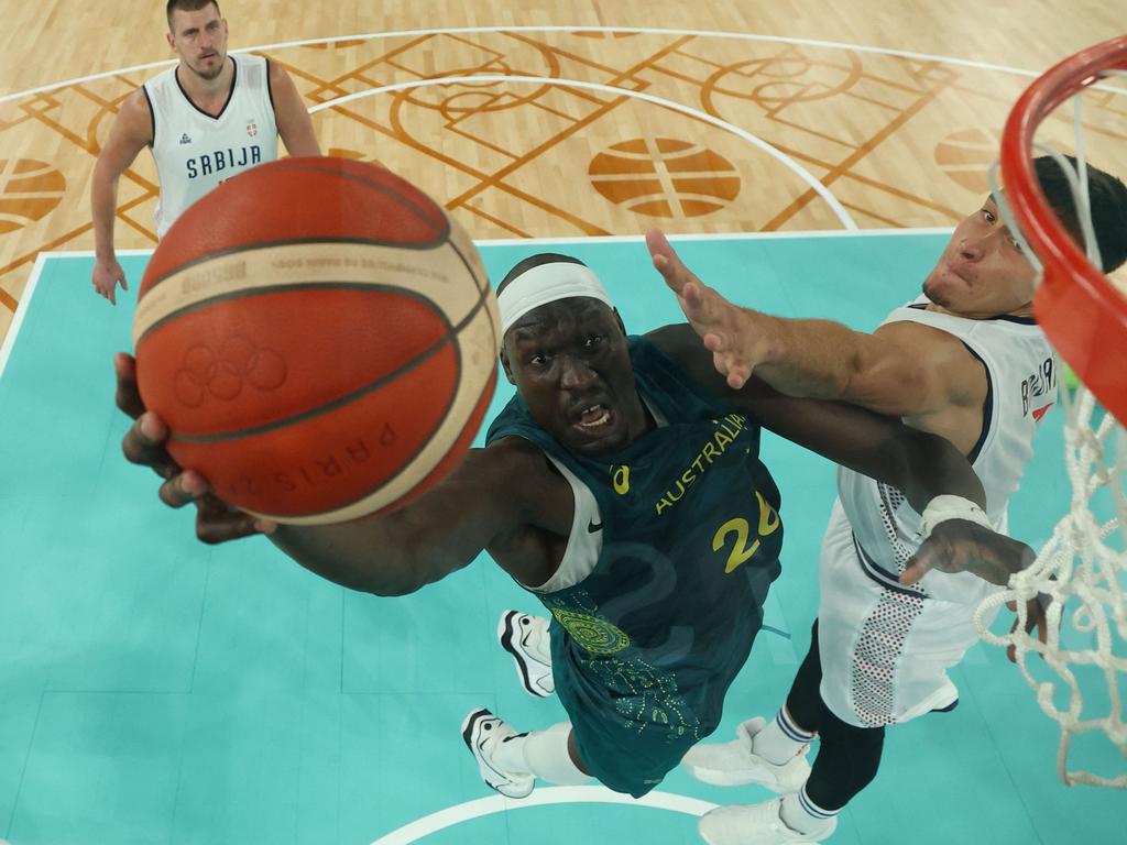 Duop Reath goes to the basket past Serbia's Bogdan Bogdanovic. Picture: AFP