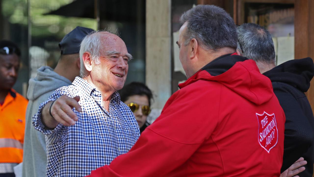 Co owner Nino Pangrazio at the cafe today is greeted by Salvation Army’s Major Brendan Nottle. Picture: David Crosling