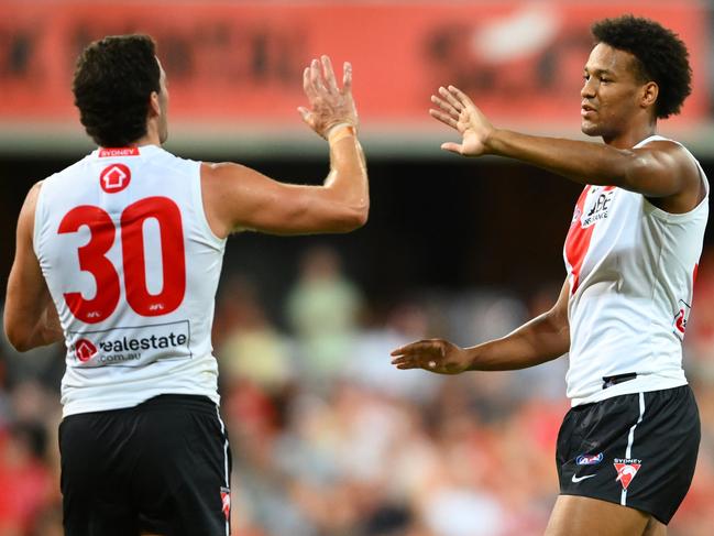 Joel Amartey, right, and Tom McCartin celebrate a Swans goal. Picture: Matt Roberts/AFL Photos