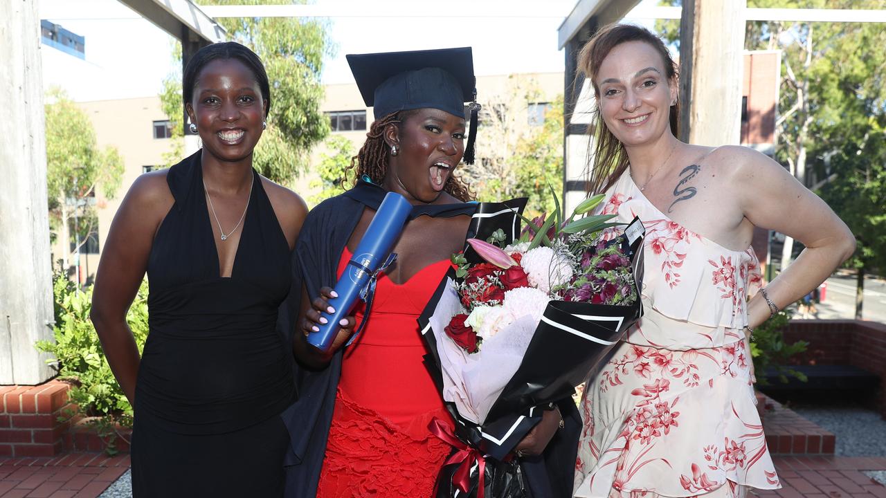 Steph Mbru, graduate Sharon Chemiat, and Alex Baggio. Picture: Alan Barber