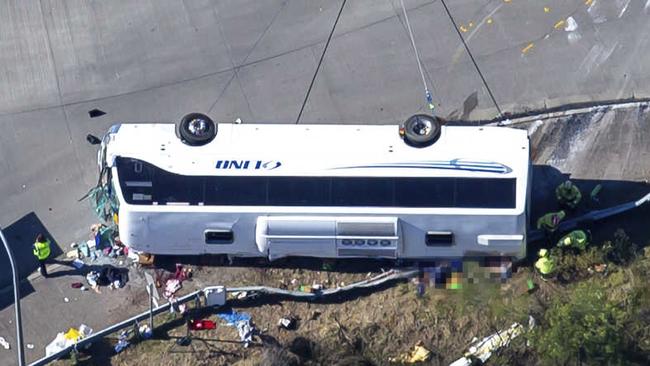 The bus lies on its side after the crash. Picture: NCA NewsWire / Christian Gilles