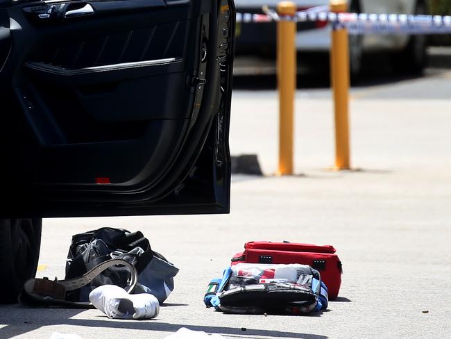 Bullet shells on the ground next to Mick Hawi’s black Mercedes in the Rockdale Fitness Firstcar park on Thursday. Picture: Toby Zerna.