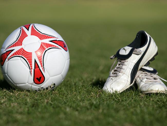 Generic soccer ball and football boots.