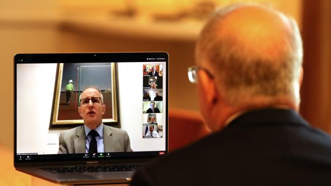 PM Scott Morrison talking to the Communications Minister Paul Fletcher chairing. Picture: Adam Taylor