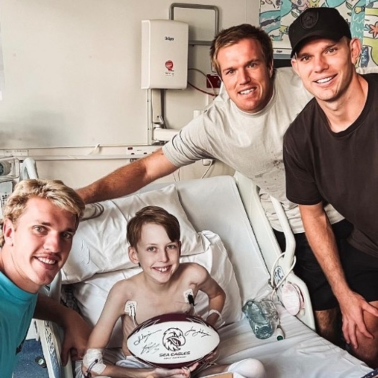 The Trbojevic brothers with cancer patient Beau Hewitt. Credit: Supplied.