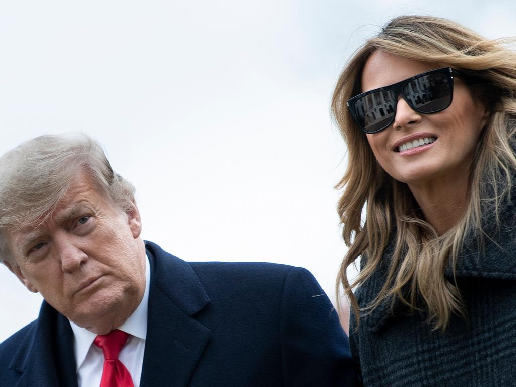 US President Donald Trump and First Lady Melania Trump walk from Marine One in Washington, DC. Picture: Brendan Smialowski