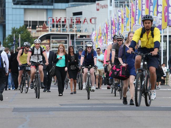 Cyclists and pedestrians on a crowded section of shared pathway joining the CBD with Darling Harbour. Picture: Richard Dobson
