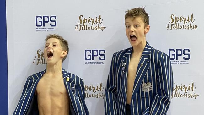 The Nudgee junior swim captains cheer with delight after learning of their win.