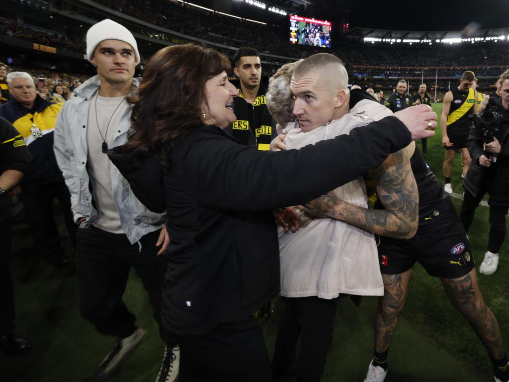 Martin hugs his grandma Lois and mum Kathy after his 300th game. Picture: Michael Klein