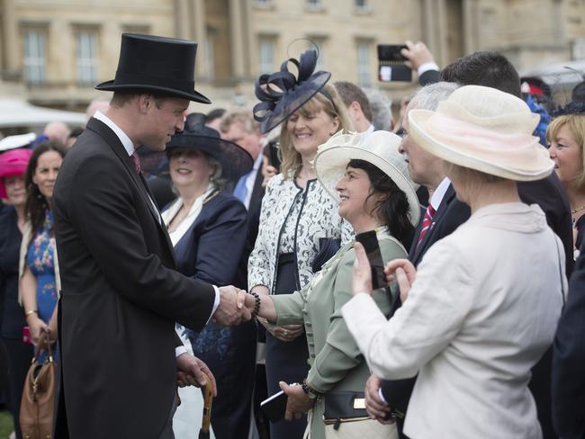 Prince William, Duke of Cambridge talks to guests during a garden party at Buckingham Palace on May 16, 2017 in London, England. Picture: Getty