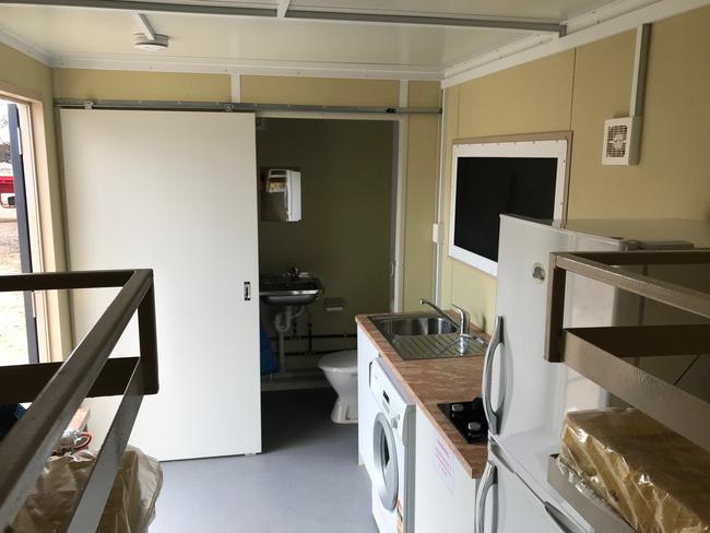 The recovery pods offer basic kitchen, bathroom and sleeping facilities that people can use while they rebuild their houses.