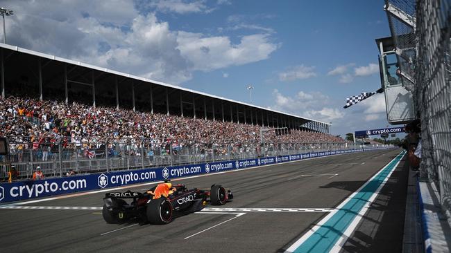 The checkered flag is waved for Red Bull’s Max Verstappen