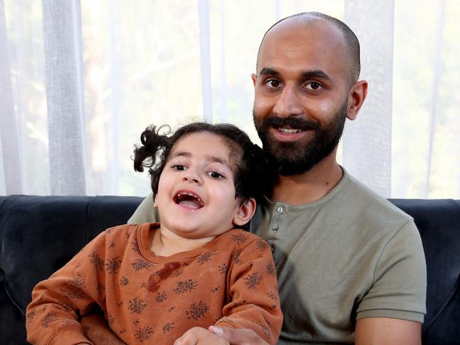 Amelia Khan, pictured with father Daniel, was one of two babies given nitrous oxide after it was mistaken for oxygen when she was born at Bankstown-Lidcombe hospital in 2016, suffering permanent brain damage. Picture: Toby Zerna