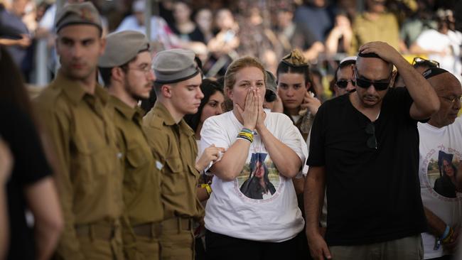 The parents of Israeli soldier Corporal Noa Marcian attend her funeral last November. The 19-year-old who served in the Combat Intelligence Collection Corps was captured by Hamas fighters during their October 7 attack. Picture: Getty Images