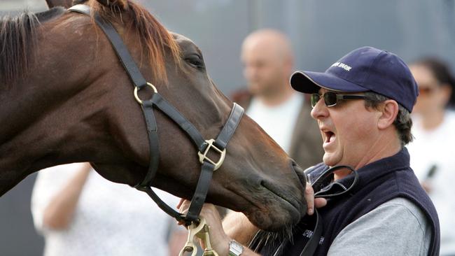 The great Makybe Diva gives trainer Lee Freedman a playful nip.