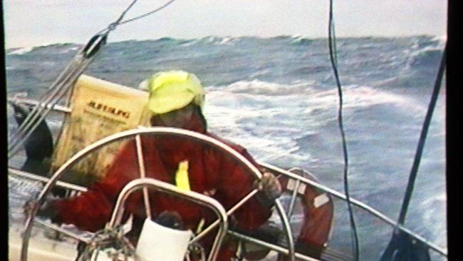 Helmsman Derek Quinliven battles the huge seas while on board "Alexander of Cresswell" during the 1998 Sydney to Hobart race.  