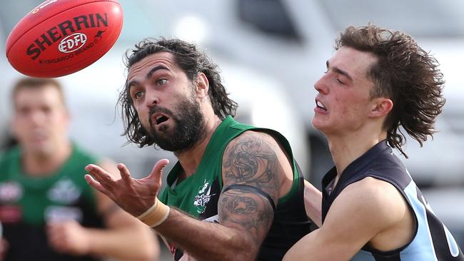 Greenvale’s Courtenay Dempsey and Aberfeldie’s Harrison Fry lock horns. Picture: Hamish Blair